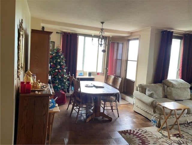 151 Buffalo Ave Unit 404, Niagara Falls, NY 14303 - dining area featuring plenty of natural light and a chandelier