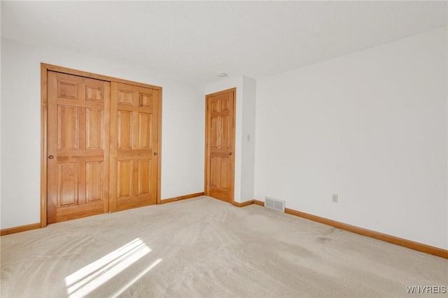 24 Bluejay Cir, Lancaster, NY 14086 - unfurnished bedroom featuring baseboards, carpet floors, and a closet