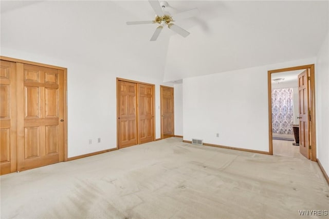 24 Bluejay Cir, Lancaster, NY 14086 - unfurnished bedroom featuring baseboards, high vaulted ceiling, two closets, light colored carpet, and ensuite bathroom