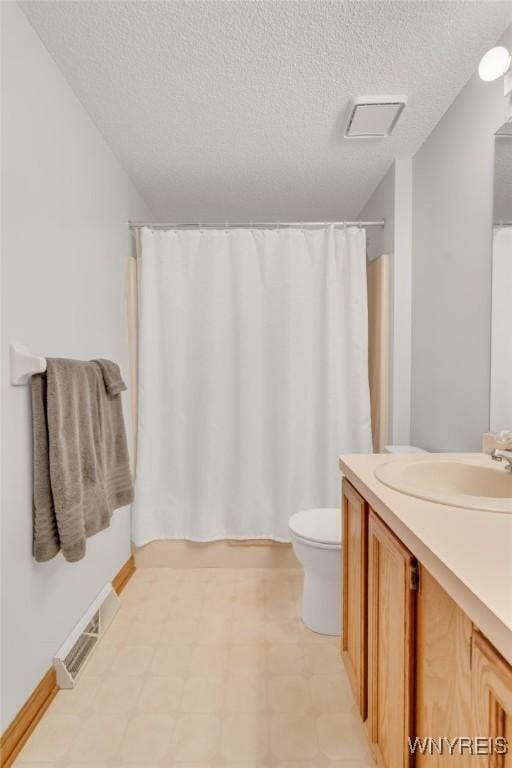 24 Bluejay Cir, Lancaster, NY 14086 - bathroom with vanity, toilet, a textured ceiling, tile patterned floors, and shower / tub combo with curtain