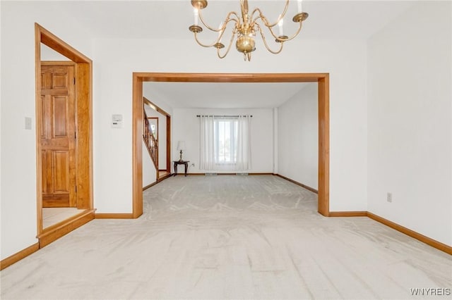 24 Bluejay Cir, Lancaster, NY 14086 - carpeted spare room featuring a chandelier, baseboards, and stairway