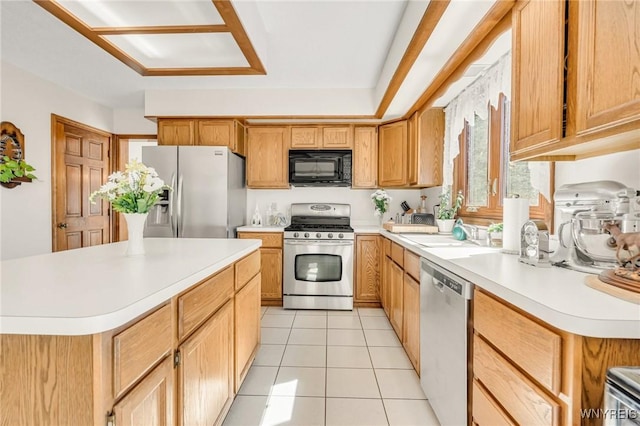 24 Bluejay Cir, Lancaster, NY 14086 - kitchen with appliances with stainless steel finishes, light countertops, light tile patterned floors, and a sink