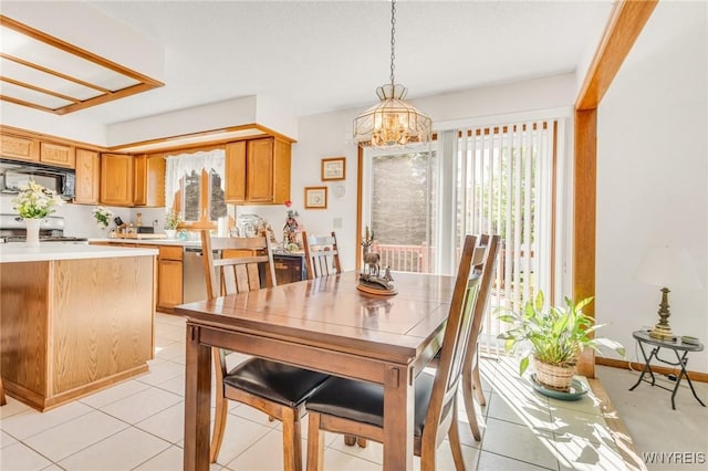 24 Bluejay Cir, Lancaster, NY 14086 - dining space featuring a chandelier and light tile patterned floors