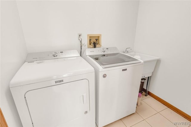 24 Bluejay Cir, Lancaster, NY 14086 - laundry area with independent washer and dryer, light tile patterned floors, and baseboards