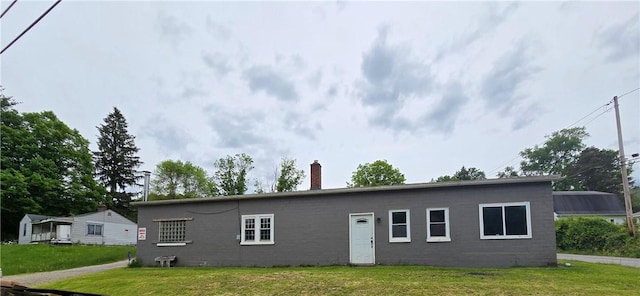 1077 Looker Mtn, Otto Twp, PA 16745 - back of property featuring a chimney and a lawn
