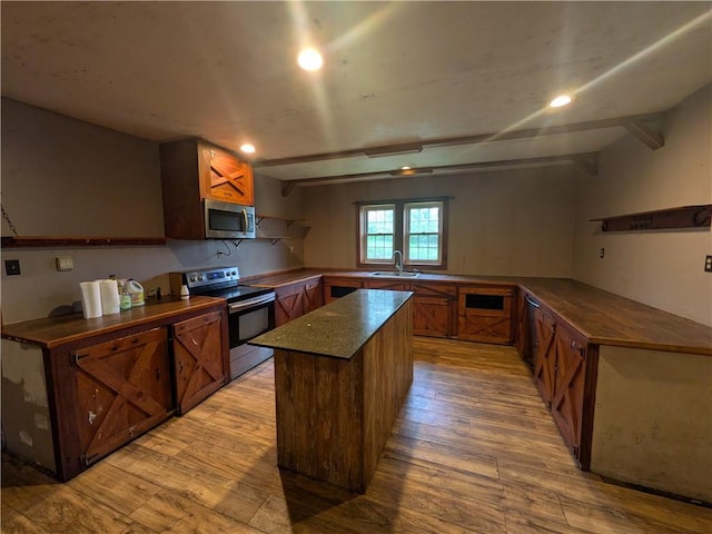 1077 Looker Mtn, Otto Twp, PA 16745 - kitchen featuring stainless steel appliances, light wood-type flooring, a sink, a kitchen island, and butcher block countertops