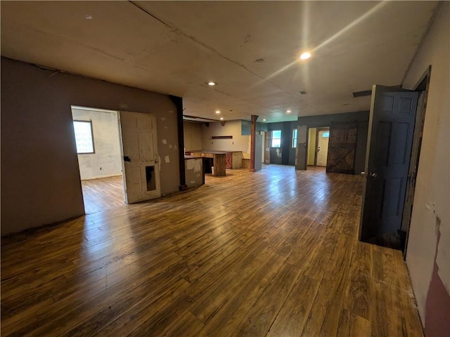 1077 Looker Mtn, Otto Twp, PA 16745 - unfurnished living room featuring dark wood-style flooring and recessed lighting