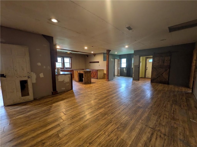 1077 Looker Mtn, Otto Twp, PA 16745 - unfurnished living room featuring hardwood / wood-style flooring, recessed lighting, and a fireplace