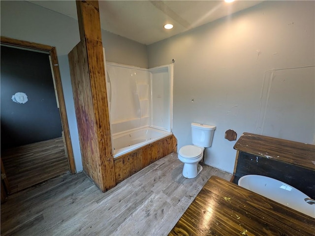 1077 Looker Mtn, Otto Twp, PA 16745 - full bathroom featuring a bathtub, wood finished floors, and toilet