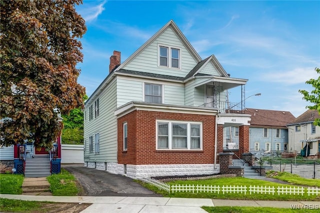 405 W Ferry St, Buffalo, NY 14213 - view of front of home with a chimney, brick siding, and a balcony