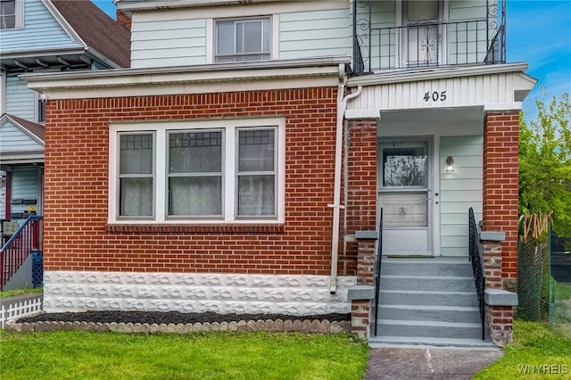 405 W Ferry St, Buffalo, NY 14213 - property entrance featuring brick siding and a balcony