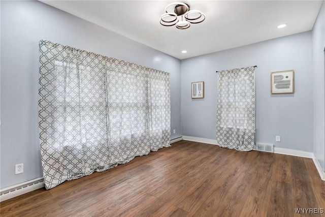 405 W Ferry St, Buffalo, NY 14213 - empty room featuring wood finished floors, baseboard heating, baseboards, and recessed lighting