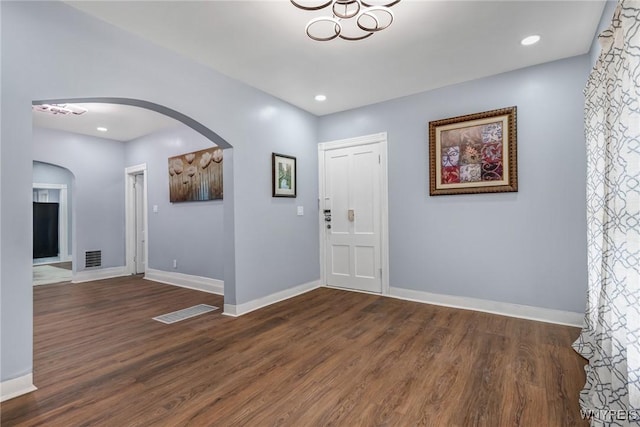 405 W Ferry St, Buffalo, NY 14213 - entrance foyer with arched walkways, wood finished floors, and baseboards
