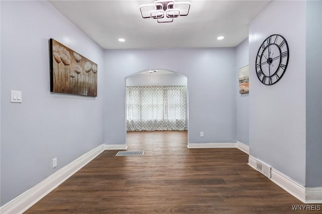405 W Ferry St, Buffalo, NY 14213 - empty room with arched walkways, baseboards, dark wood-type flooring, and recessed lighting