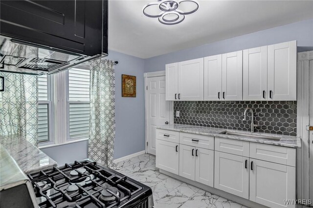 405 W Ferry St, Buffalo, NY 14213 - kitchen featuring a sink, range with gas stovetop, tasteful backsplash, white cabinetry, and light stone countertops