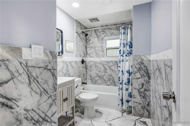 405 W Ferry St, Buffalo, NY 14213 - full bath with tile walls, shower / bathtub combination with curtain, toilet, vanity, and marble finish flooring
