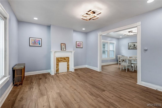 405 W Ferry St, Buffalo, NY 14213 - living room featuring baseboards, wood finished floors, a high end fireplace, and recessed lighting