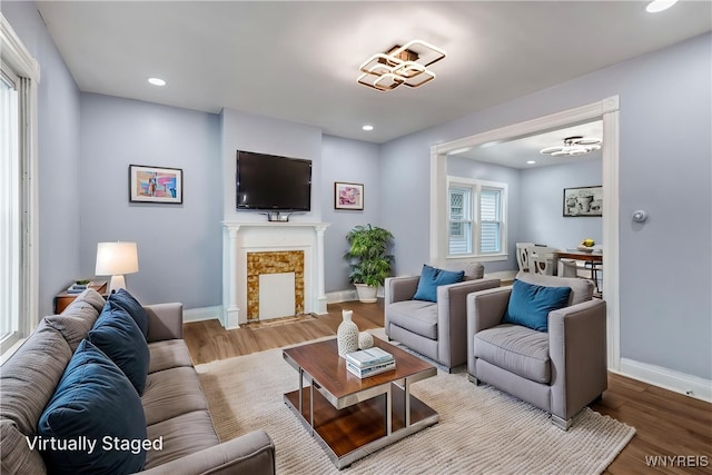405 W Ferry St, Buffalo, NY 14213 - living room with wood finished floors, baseboards, a fireplace with flush hearth, and recessed lighting