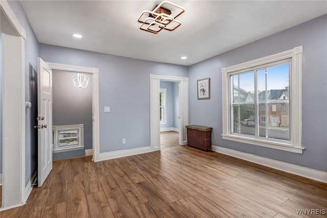 405 W Ferry St, Buffalo, NY 14213 - unfurnished bedroom featuring wood finished floors, baseboards, and recessed lighting