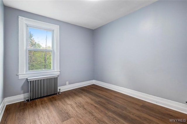405 W Ferry St, Buffalo, NY 14213 - empty room featuring radiator, baseboards, and dark wood-type flooring