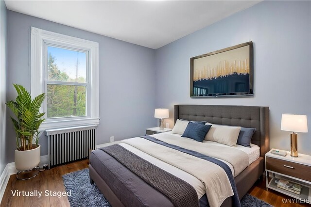 405 W Ferry St, Buffalo, NY 14213 - bedroom with radiator heating unit, wood finished floors, and baseboards