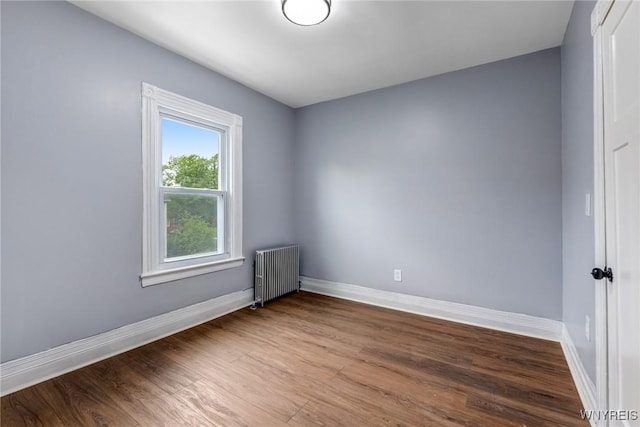 405 W Ferry St, Buffalo, NY 14213 - spare room featuring radiator, wood finished floors, and baseboards