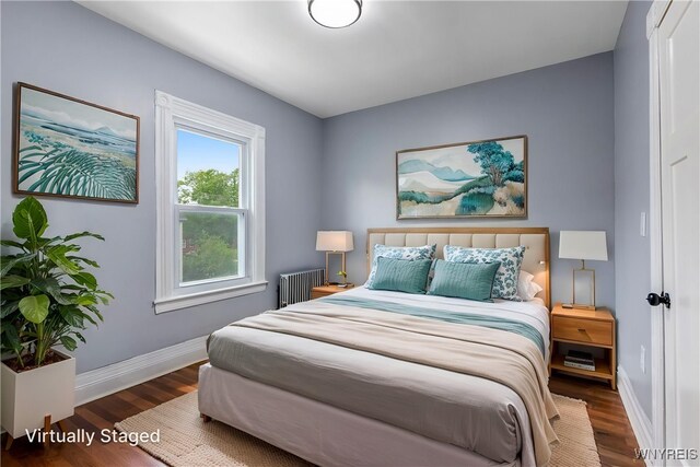 405 W Ferry St, Buffalo, NY 14213 - bedroom featuring wood finished floors, baseboards, and radiator heating unit