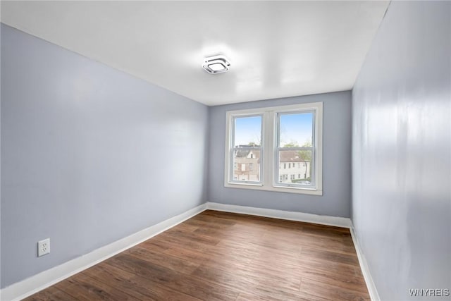 405 W Ferry St, Buffalo, NY 14213 - empty room featuring baseboards and dark wood-style flooring