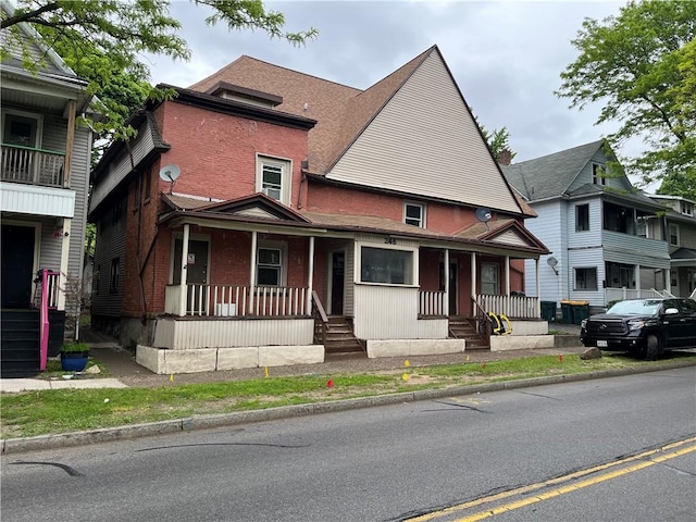 244 Driving Park Ave, Rochester, NY 14613 - view of front facade featuring a porch and brick siding