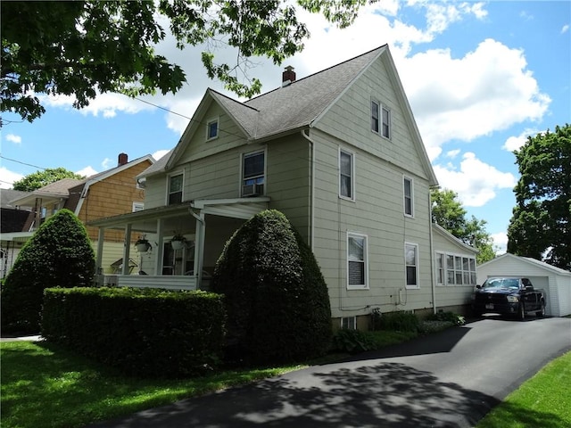 136 Platt St, Erwin, NY 14870 - view of property exterior with a chimney, a detached garage, an outdoor structure, and a shingled roof