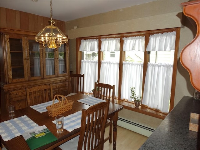 136 Platt St, Erwin, NY 14870 - dining area featuring a chandelier, a baseboard radiator, and light wood-style flooring