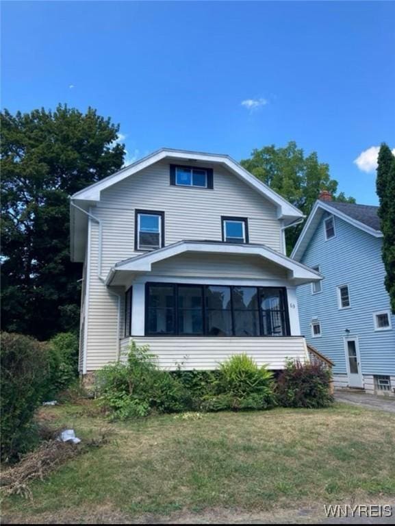 58 Nellis Park, Rochester, NY 14608 - american foursquare style home featuring a front lawn and a sunroom