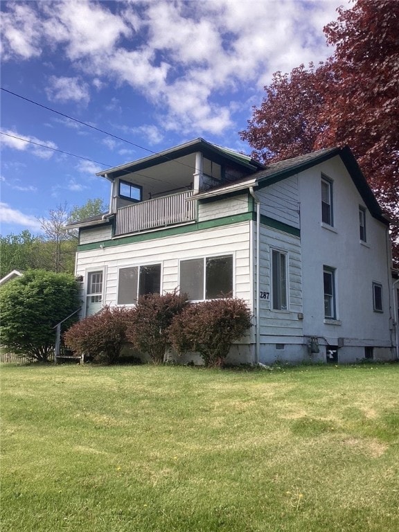 2287 State Route 352, Big Flats, NY 14903 - rear view of house with a balcony and a yard