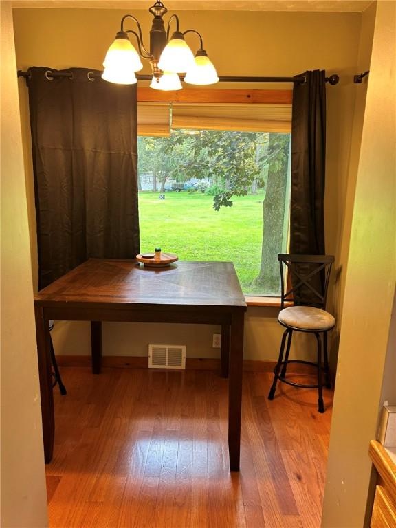 2287 State Route 352, Big Flats, NY 14903 - dining area featuring wood finished floors and a chandelier
