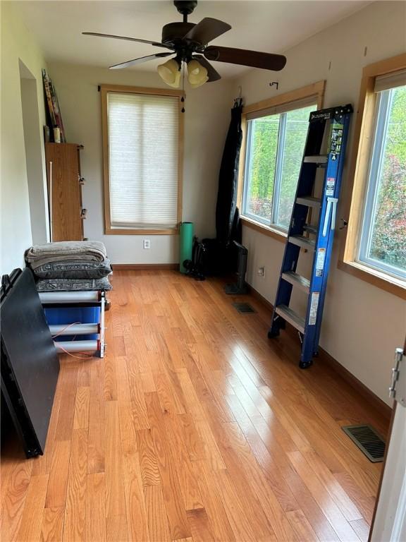 2287 State Route 352, Big Flats, NY 14903 - interior space featuring light wood-style floors, a ceiling fan, and baseboards