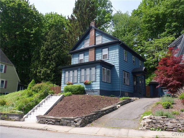 626 Roberts Ave, Syracuse, NY 13207 - american foursquare style home with stairway and a chimney