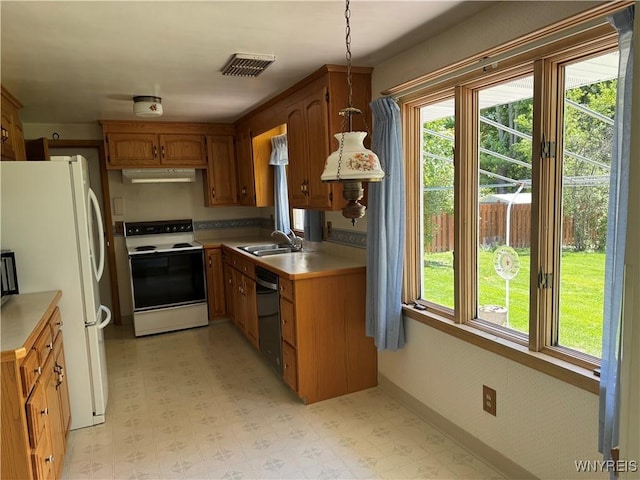 725 Warren Dr, Aurora, NY 14052 - kitchen featuring electric range, freestanding refrigerator, under cabinet range hood, and light floors