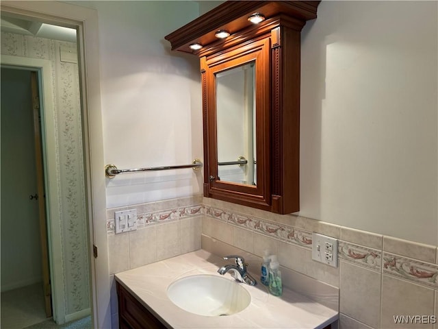 725 Warren Dr, Aurora, NY 14052 - bathroom featuring vanity and tile walls