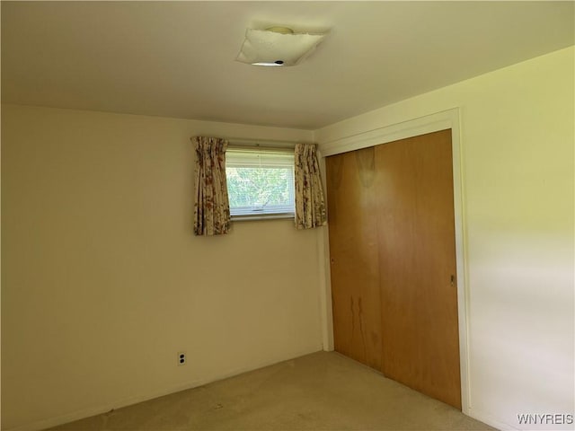 725 Warren Dr, Aurora, NY 14052 - unfurnished bedroom with carpet flooring and a closet