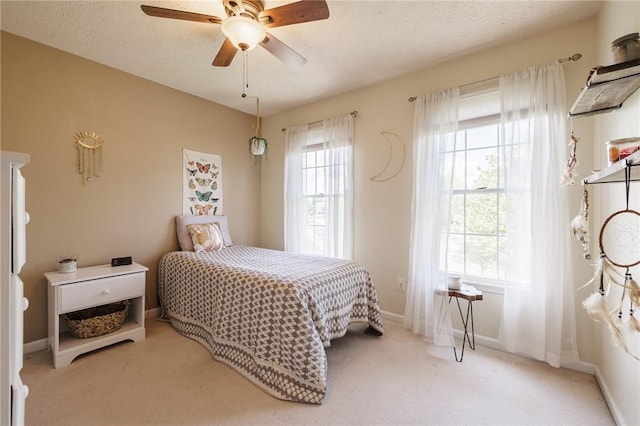 56 Edenfield Rd, Penfield, NY 14526 - bedroom featuring carpet flooring, baseboards, a textured ceiling, and ceiling fan