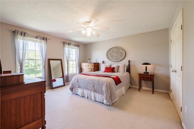 56 Edenfield Rd, Penfield, NY 14526 - bedroom with light colored carpet, a textured ceiling, baseboards, and ceiling fan