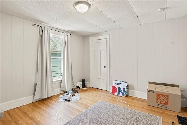 262 Pearl St, Rochester, NY 14607 - spare room with wood finished floors, baseboards, and a paneled ceiling