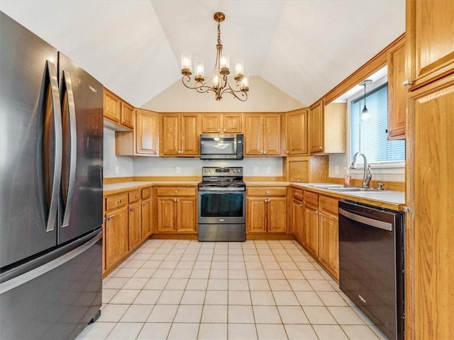 26 Groveland, Geneseo, NY 14454 - kitchen featuring appliances with stainless steel finishes, a sink, a chandelier, vaulted ceiling, and light countertops