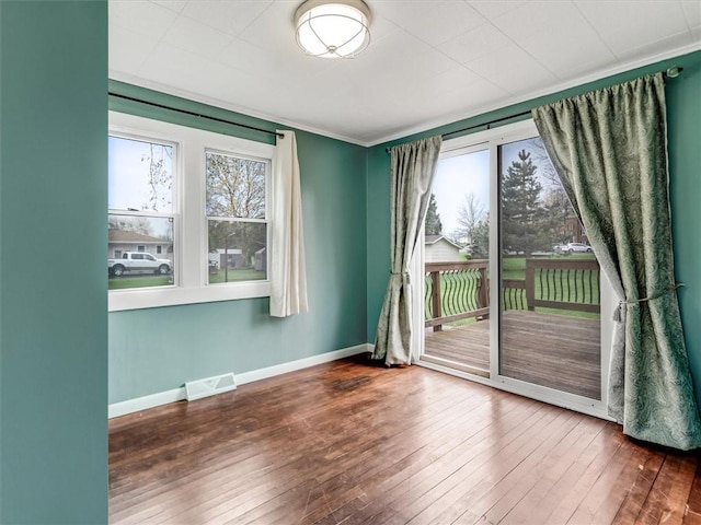 26 Groveland, Geneseo, NY 14454 - empty room with hardwood / wood-style flooring, baseboards, and ornamental molding