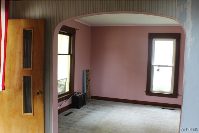 116 Merden St, Salamanca-City, NY 14779 - unfurnished room featuring wallpapered walls, baseboards, carpet flooring, healthy amount of natural light, and ornamental molding