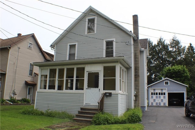 116 Merden St, Salamanca-City, NY 14779 - view of front facade with entry steps, a detached garage, an outdoor structure, a front yard, and a sunroom