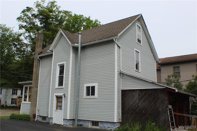 116 Merden St, Salamanca-City, NY 14779 - view of side of home with a chimney and a shingled roof