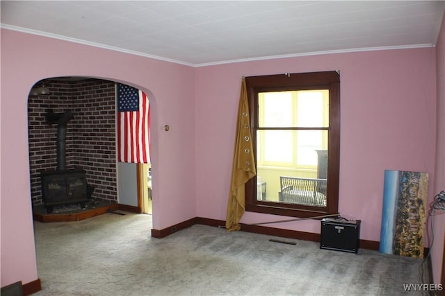 116 Merden St, Salamanca-City, NY 14779 - spare room with carpet flooring, baseboards, a wood stove, and ornamental molding