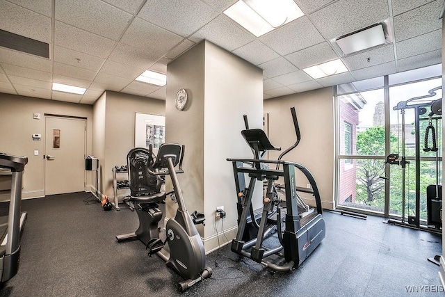 132 Lakefront Blvd Unit 204, Buffalo, NY 14202 - workout area featuring healthy amount of natural light, a paneled ceiling, expansive windows, and baseboards