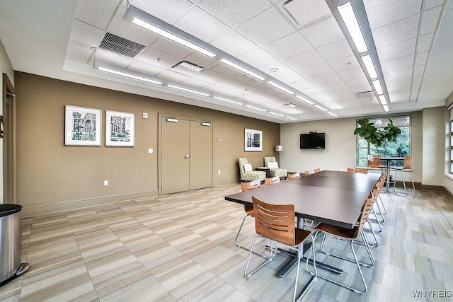 132 Lakefront Blvd Unit 204, Buffalo, NY 14202 - dining room featuring baseboards and a paneled ceiling